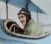 man inside biplane